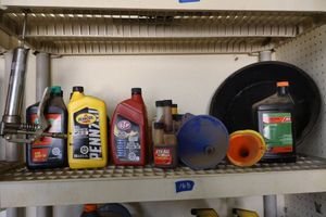 lot 168 image: Automotive lot oil, bar and chain oil, and more