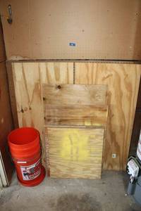 lot 191 image: Plywood, peg board, and orange buckets