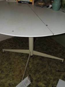 lot 56 image: white patio round dining table with 1 leaf