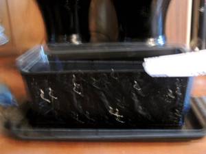 lot 135 image: black ornate pan with tray vases and dcor