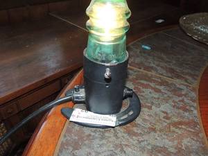 lot 92 image: Light with blue insulation on Horse shoe Base