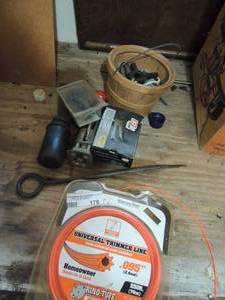 lot 176 image: weed eater string, screws, grease gun, and more