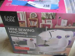 lot 238 image: mini sewing machine