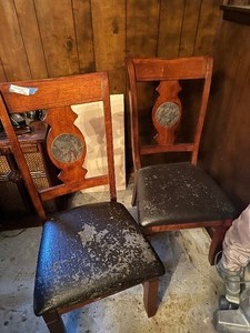 lot 21 image: Dining chairs  wood frame with inlaid tile in back and vinyl seat( final has some damage). Matching table in lot 20.