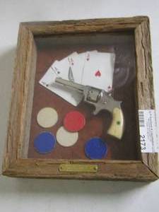 lot 2173 image: Shadow box of a  Boot Pistol  with cards and poker chips