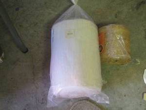 lot 2204 image: roll of cloth- new roll of twine