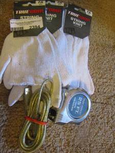 lot 2394 image: string knit hand gloves, 25ft measuring tape and charger