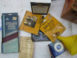 lot 2326 image: leather steering wheel cover, auto light bulbs, funnel