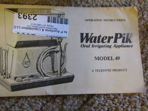 lot 2393 image: water pik oral irrigating model 49 used