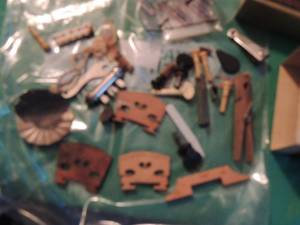 lot 2557 image: Bridges and assorted violin parts
