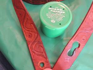 lot 2492 image: Leather guitar strap and guitar humidifier