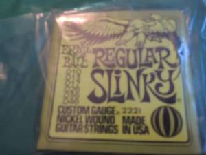 lot 2618 image: Ernie Ball regular Slinky Nickel wound guitar strings