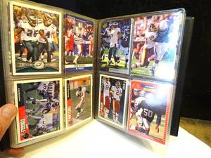 lot 169 image: APPROX 75 ASSORTED FOOTBALL CARDS IN BASKETBALL COLLECTORS BINDER