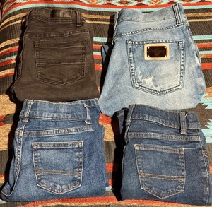 lot 205 image: One (1)Pair of Boys Made in Italy Dolce &amp Gabbana size 14, One (1) Pair of Kenneth Cole Size 10, &amp Two (2) Pair of Wonder Nation Boot Cut Size 10 Jeans