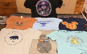lot 206 image: Seven (7) Vintage Themed T-Sized M-XXL T-Shirts - Including Buc-Eds, Ford Mustang, Trans Am, Disney, The North Face, &amp Telluride, Colorado
