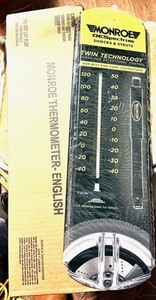 lot 38 image: NEW Metal Wall-Hanging IndoorOutdoor Monroe ORSpectrum Shocks and Struts Thermometer