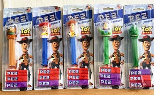 lot 246 image: Five (5) Toy Story Themed PEZ Dispensers - Including Woody, Buzz Lightyear, &amp Rex