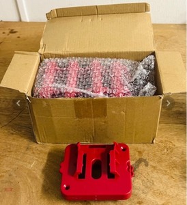 lot 173 image: Box of Battery Holders for Milwaukee, Hart, and Others