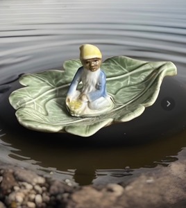 lot 232 image: Vintage LeprechaunElfPixie Floating on a Leaf by Shamrock Pottery Ireland