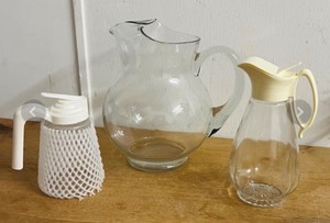 lot 274 image: Libbey Hand-Blown Clear Crisa Acapulco Mr. Koolade Pitcher, &amp Two Vintage Syrup Pitchers