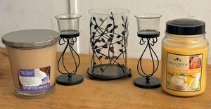 lot 280 image: Metal Leaf Hurricane Candle Holder, Two (2) Black Metal TealightVotive Candle Holders, &amp Two Scented Candles - Paula Dean Collection  Pina Colada Smoothie, and Better Homes and Garden Creamy Tahitian Coconut