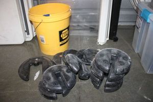 lot 37 image: Weight plates for mic stands