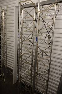 lot 25 image: Pair of triangular aluminum trusses with rope lights