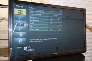 lot 44 image: Panasonic plasma HDTV with wall mount bar. Model TC-P50ST30