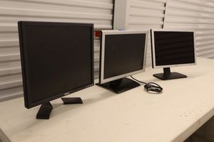lot 104 image: Three monitor screens as shown