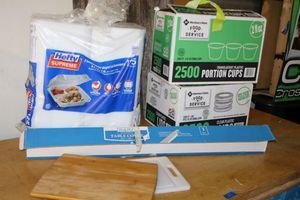 lot 107 image: Kitchen plastic table cover roll, portion cups and lids, Hefty 3 compartment hinged lid containers, and cutting boards