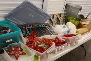 lot 113 image: Christmas decorations, buckets, table decorations and flowers