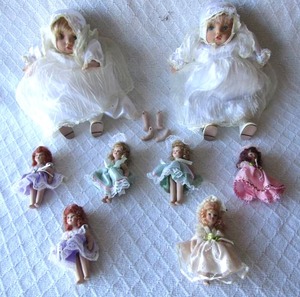 lot 502 image: Vintage ceramic dolls, one with internal music box