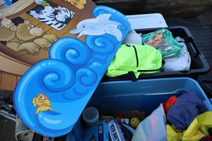 lot 146 image: Kids toys and supplies with cardboard Noahs Ark sign