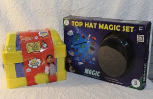 lot 14 image: Ryans world  treasure set and top hat magic set both unopened but the Ryans world some package damage as seen in picture but everything is good in side unopened