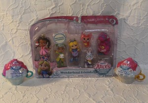 lot 27 image: Disney Junior Alices Wonderland Bakery Wonderland Friends figure set.  And  2- Disney Junior Alices Wonderland Bakery Tea Party Capsule Figures Mystery Pack. Unopened