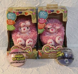 lot 31 image: 2-Curlimals Bibi the Bunny interactive plush toy and 2-Toytown Express Monster Slap Bracelet. unopened