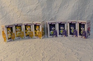 lot 38 image: 8-set of Care Bears Micro Plush toys. These are small, 3-inch plush toys that come in packaging that resembles the full-size Care Bear boxes.  All unopened