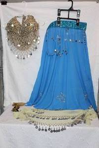 lot 81 image: blue, full-length belly dance skirt with silver sequins and a top and a pair of finger cymbals, also known as zills or sagat. And much more see pictures