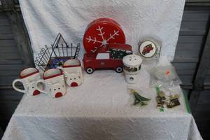 lot 101 image: Christmas lot tin can truck candy jar with truck on it and reindeer cups Christmas ornaments and much more see photos