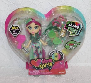 lot 111 image: Vibe Girls doll named Jamie. Jamies theme is Nature Vibe. The doll comes with several accessories, including a color-changing Vibe Ring, a Share Good Vibes diary, and 50 positive messaging stickers.