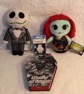 lot 198 image: Nightmare before Christmas plushies and makeup pallet but the mirror is broken and a night light