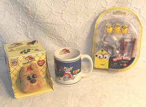 lot 202 image: Pound puppy and pound puppy cup and a minions toy