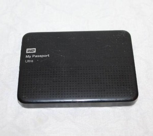 lot 233 image: a Western Digital (WD) My Passport Ultra portable external hard drive.