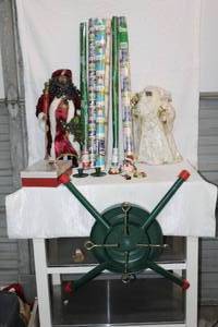 lot 235 image: Christmas lot metal tree stand and wrapping paper  Santa Claus figures ornaments and more see pictures