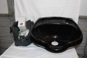 lot 262 image: black shampoo bowl, which is a piece of equipment used in hair salons and barbershops for washing hair. And a bag with the hardware in it