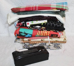 lot 299 image: Lot of material and buttonhole maker tool