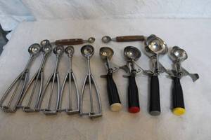 lot 325 image: collection of stainless steel ice cream and cookie scoops, featuring both trigger-release and spring-release mechanisms.