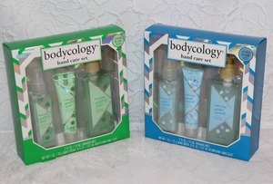 lot 334 image: Bodycology Sparkling Apple 3-piece hand care gift set.  And Bodycology Winter Coconut 3-piece hand care gift set including shimmer mist, hand cream, and nourishing hand soap