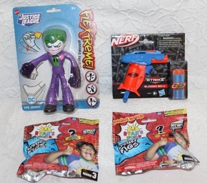 lot 380 image: The Joker Bendable Action Figure and Nerf Alpha Strike Slinger SD-1 toy blaster.and two Ryans World surprise packs all unopened