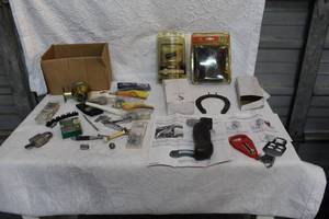 lot 393 image: Mixed lot ATV TIE DOWNS UNOPENED A Few mount kits screws door lock and much more see pictures